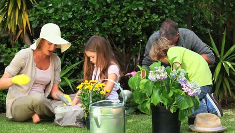 parents with their children gardening