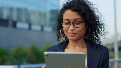 businesswoman using tablet in city