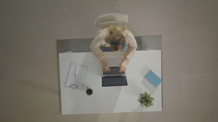 Longhaired woman doing office work