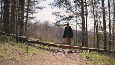 A-Young-Woman-With-Short-Hair-Runs-Through-The-Countryside-With-Her-Dog