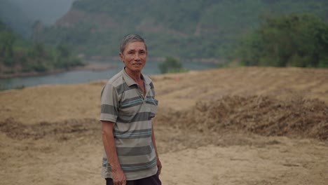 senior farmer in a rural vietnamese landscape