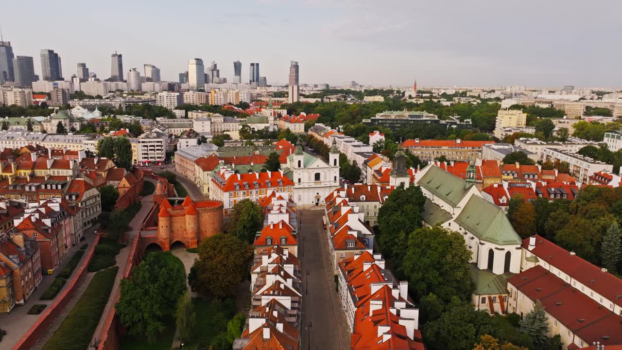 Drone establishing shot of Warsaw Old Town with Holy Spirit Church and Barbican