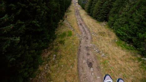 cable transport, cable car going down the mountain, tilt-up movement, cloudy weather, karpacz, poland