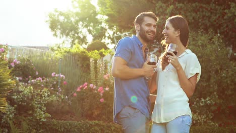 happy couple drinking red wine