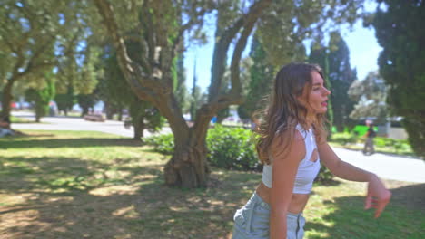 woman in a park enjoying a sunny day
