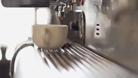 espresso being prepared in a ​coffee shop