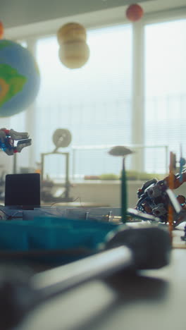 science classroom with solar system model and robot