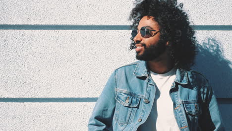 man in denim jacket and sunglasses