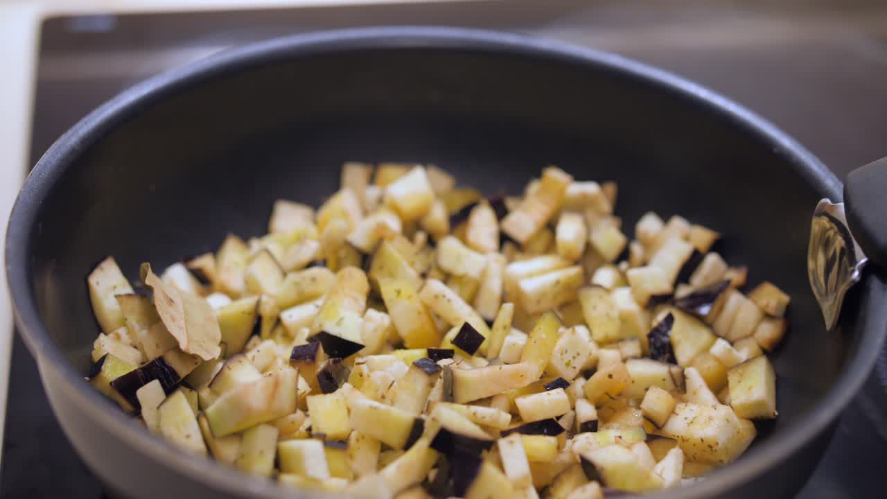 Fresh Eggplant Cut In Chunks Cooking In A Pan