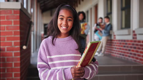 a smiling student on school campus