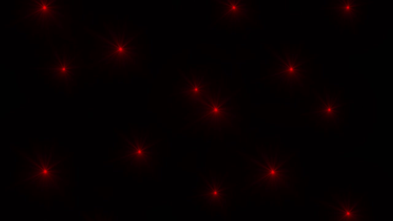 Soft red fairy lights twinkling against black background. Perfect for Christmas, holiday, or magical overlays. Seamless loop