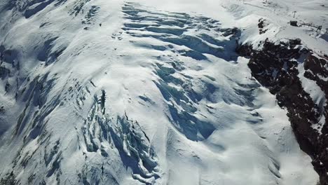 crevasse of a blue glacier in the swiss alps, saas fee