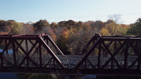 reverse drone flight over the trail truss bridge in west warwick, rhode island