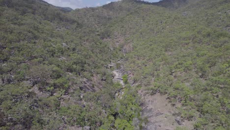 Nature-Landscape-Surrounding-Emerald-Creek-Falls-In-Mareeba,-Australia---aerial-drone-shot