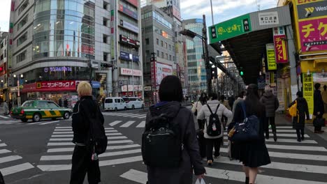 pedestrians navigating a busy urban sidewalk