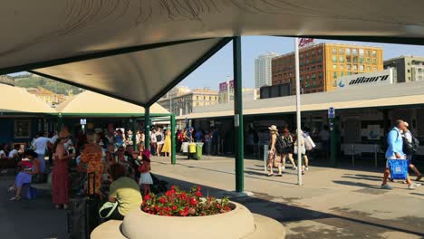 people gather and move at sorrento station