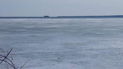 ice retreats on a frozen bay in early spring.