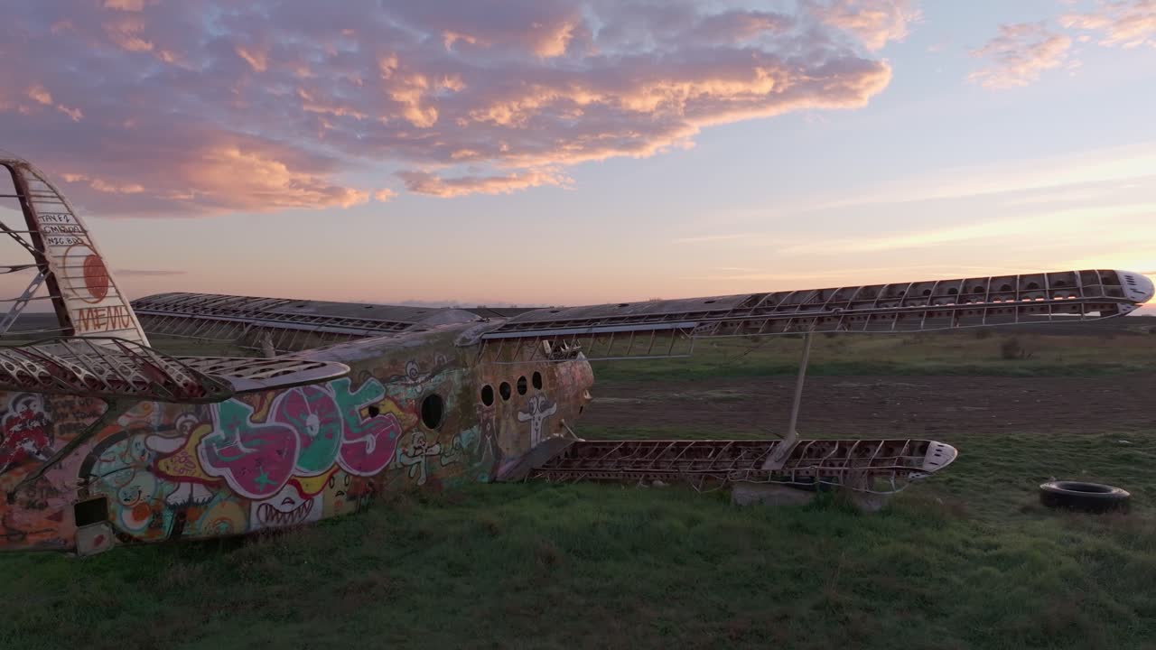 Forgotten aircraft sits still in sunlit grasslands, Kalimantsi, Bulgaria