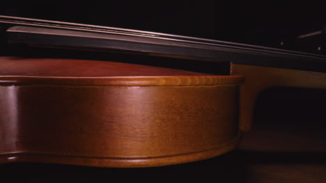 slider shot down the side of a violin