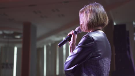 woman giving a presentation at a conference