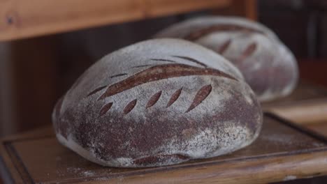 freshly baked homemade bread from the oven - sliding slowmo shot