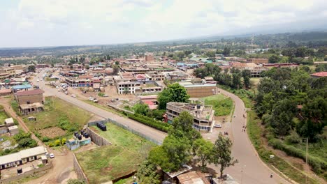 Aerial-drone-view-Open-Air-market-in-the-Loitokitok-town,-Kenya-and-mount-Kilimanjaro--Rural-village-of-Kenya