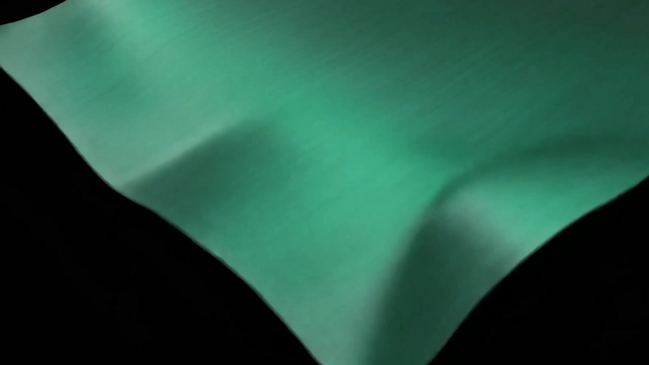 Tela Verde Ondulando y Cayendo sobre un Fondo Negro