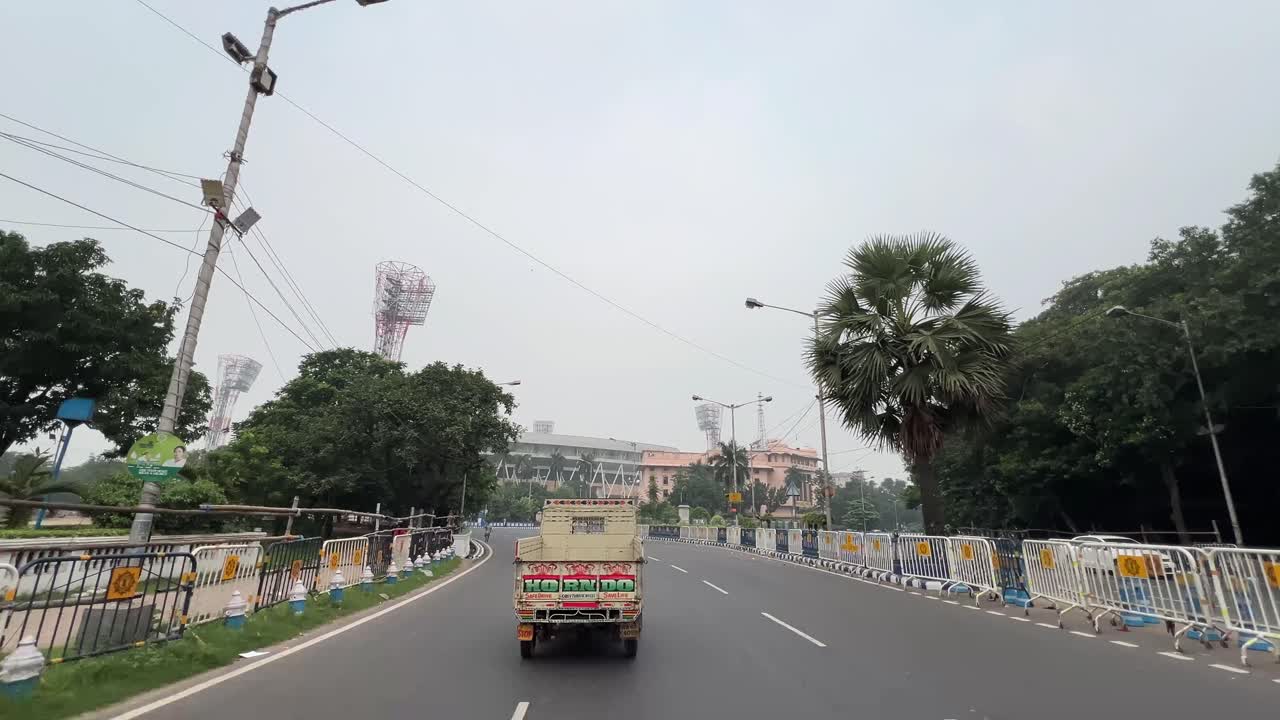 POV shot of red road approaching Eden Gardens Kolkata.