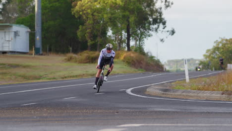 cyclists in bicycle race rounding winding road corner, 4k