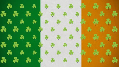 animación digital de varias hojas de trébol que se mueven contra la bandera irlandesa