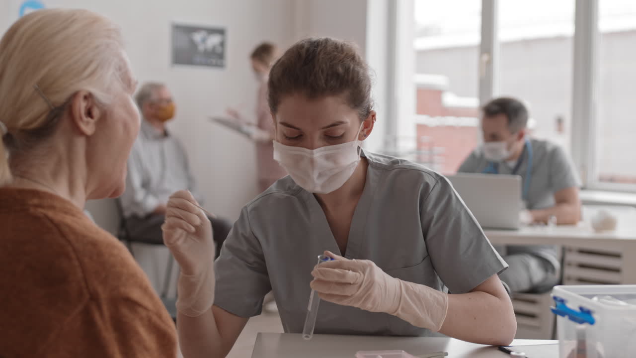 Young Nurse Collecting DNA Sample