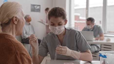 young nurse collecting dna sample