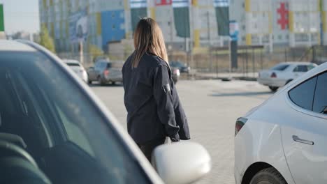 car service manager walking around office