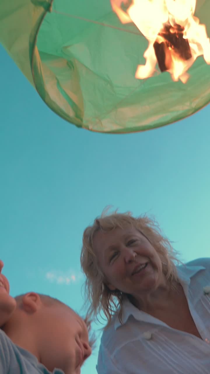 Family watching sky lantern