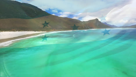 Digital-composition-of-waving-honduras-flag-against-aerial-view-of-the-beach