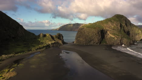 flight backwards from whatipu beach and manukau heads, auckland, huia reserve