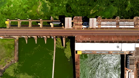 Aerial-view-of-Dam-at-reservoir-with-flowing-water,-hydroelectricity-power-station