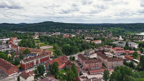 hedemora city center with lush greenery and buildings, sweden, aerial view, hyperlapse