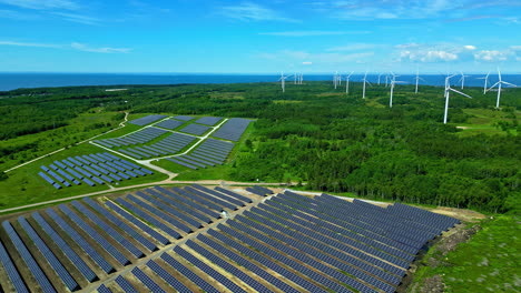 paldiski wind park with solar panels and wind turbines in estonia - aerial drone shot