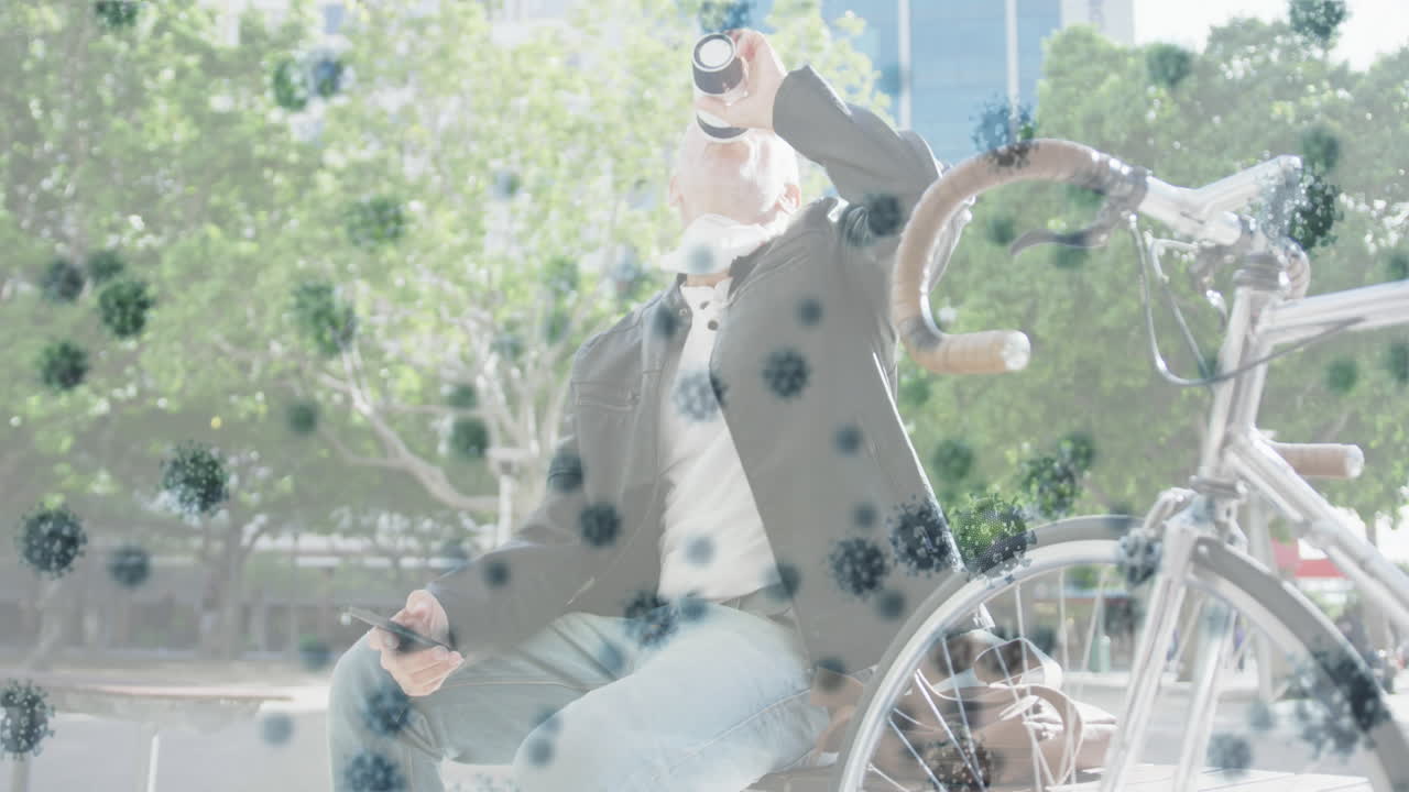 フェイスマスクを着用した高齢者の上でコビッド19細胞のアニメーション