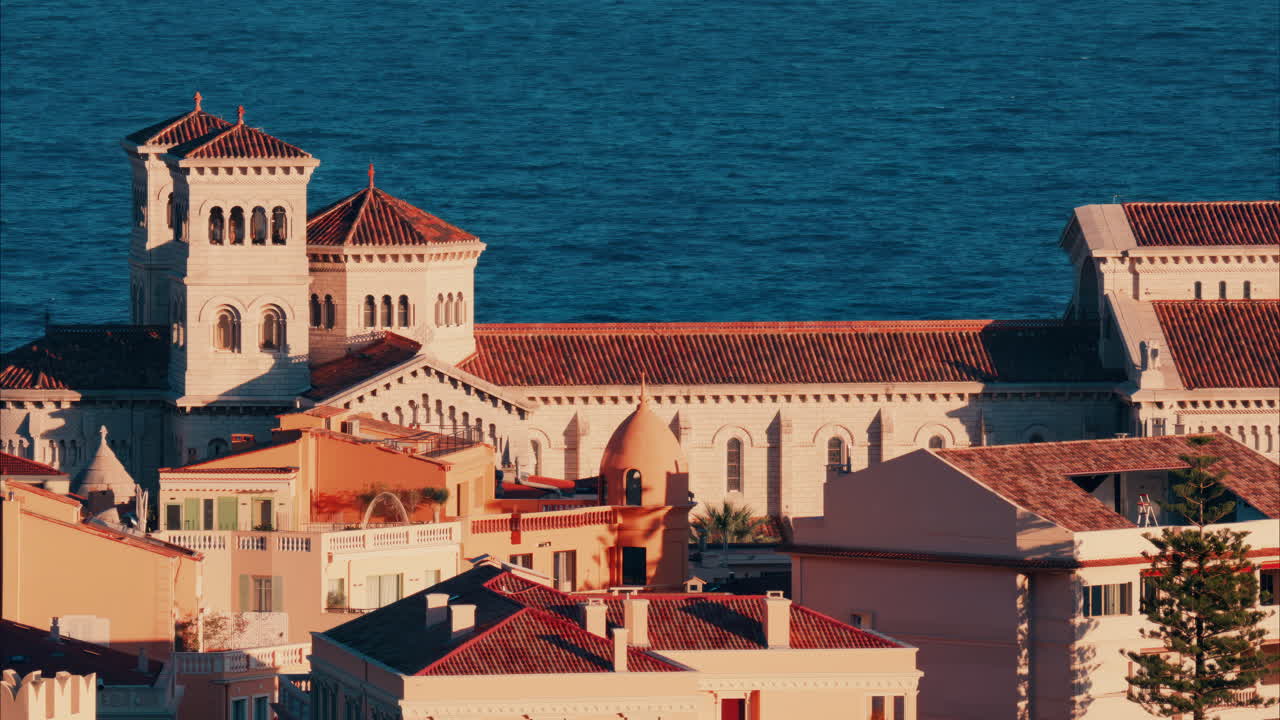 Distant aerial view of the Prince's Palace in the skyline of Monaco with the sea on the background