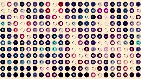 visualización abstracta de ecualizador de audio y video. movimiento. brillantes filas coloridas de pequeñas siluetas de anillos.