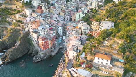 Spectacular-Aerial-View-of-Riomaggiore,-Cinque-Terre-at-Sunset-in-Italy