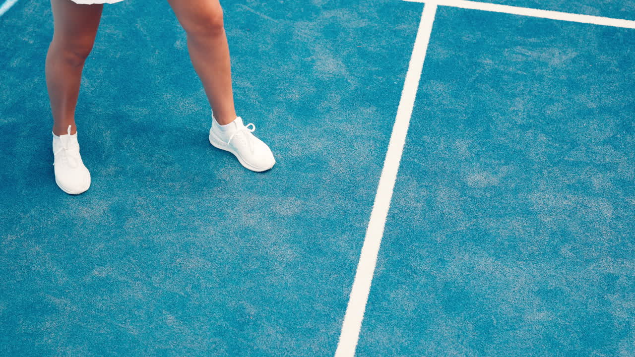 Padel Player's Feet and Ball on Blue Court