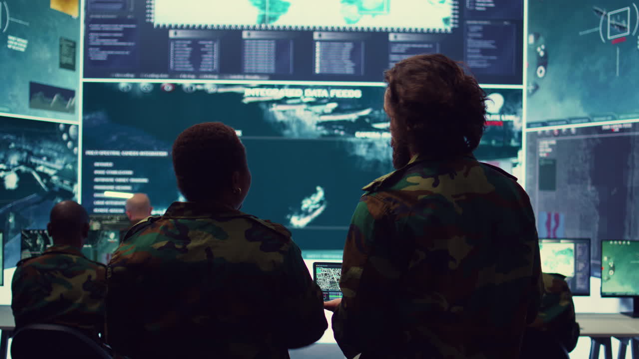 Military captains team monitoring world map via satellite CCTV footage,