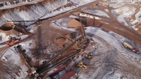 birdseye view of open pit mining, quarry mining equipment - dolly in shot