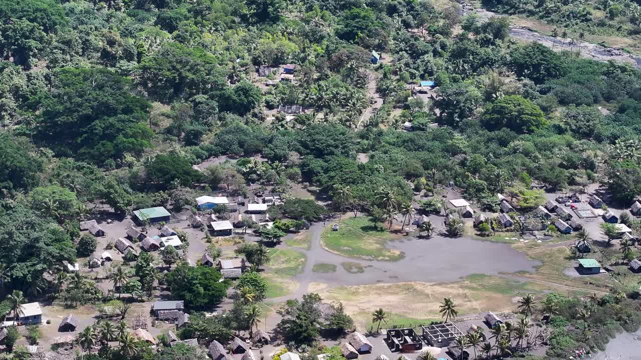 Vanuatu small village in Tanna Island, Pacific. Aerial of huts and community buildings.