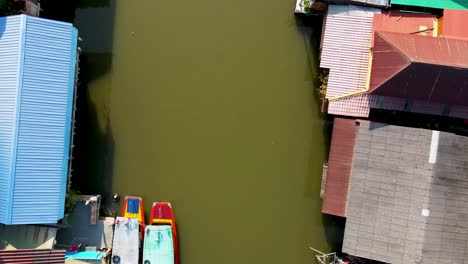 aerial birds eye view flying along khlong bangkok yai canel waterways