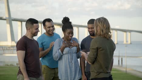 happy friends congratulating young woman with birthday