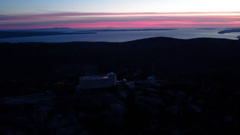 a beautiful view of the sunset and the observatory on the mountain